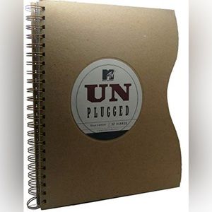 FIRST EDITION hard cover UNPLUGGED guitar shaped book.